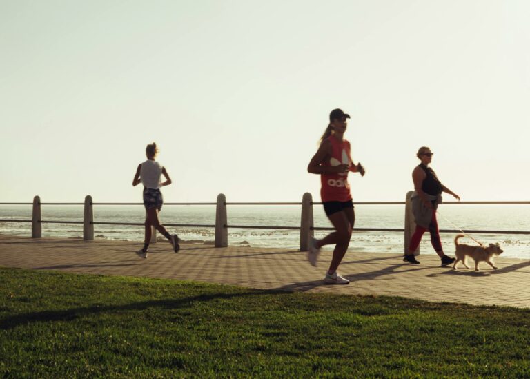 Active various women with dog on seafront